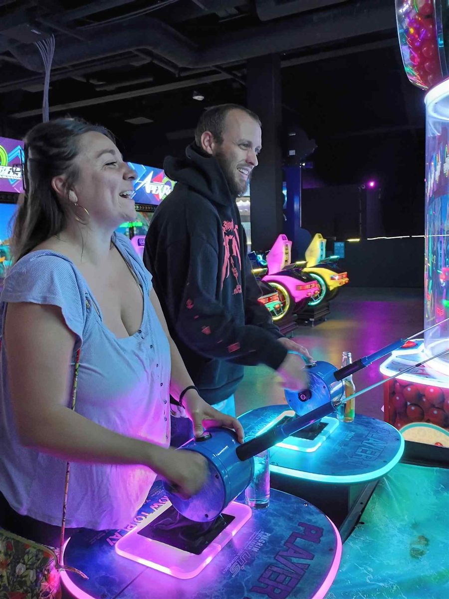 A couple together on a date night at an arcade